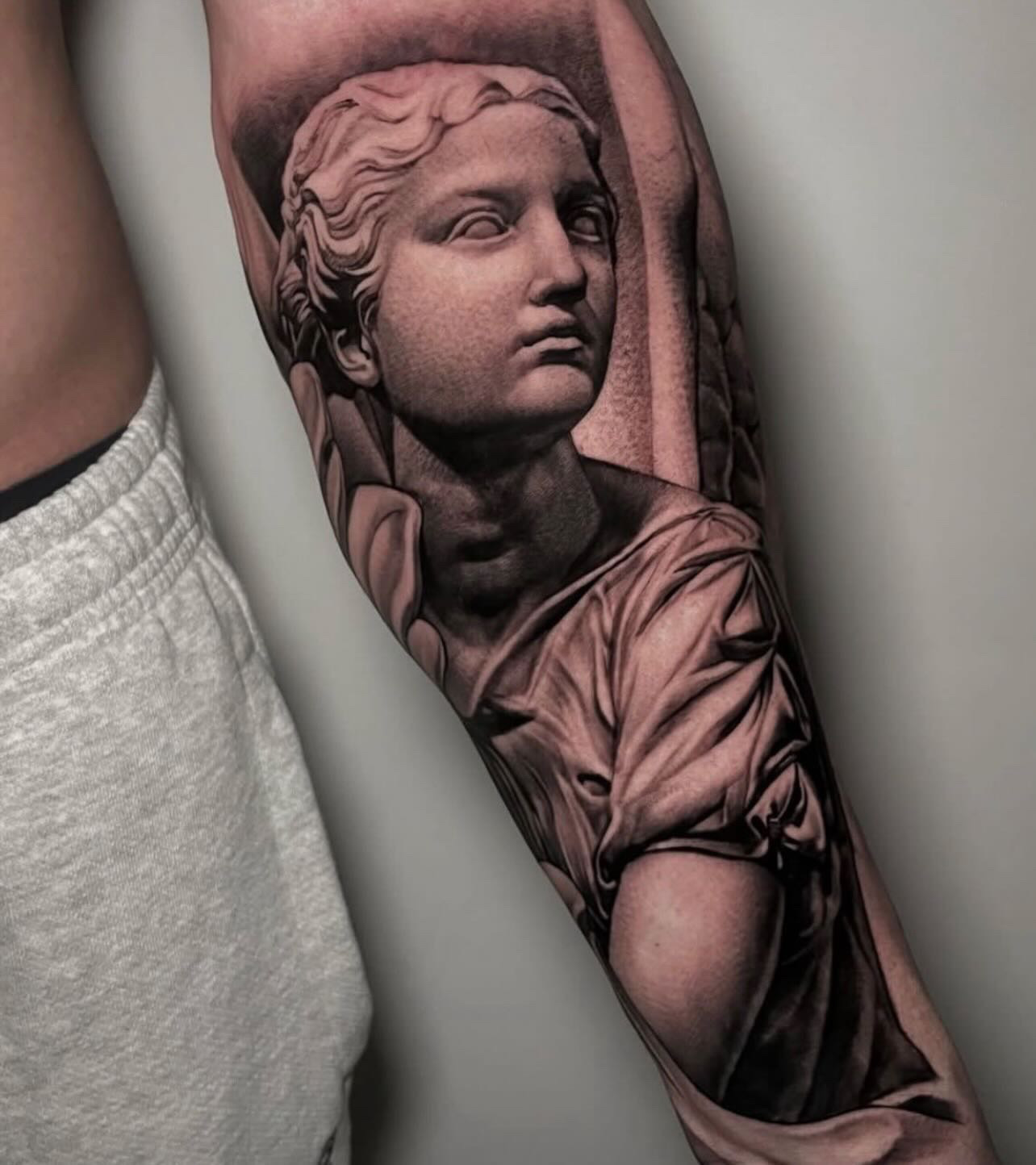Classical female statue forearm